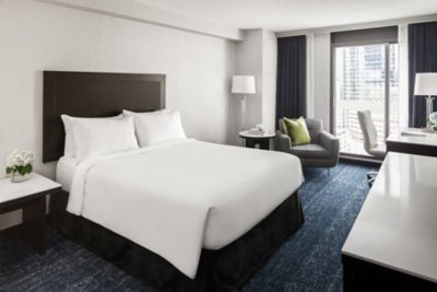renovated executive room queen bed at chelsea hotel, toronto